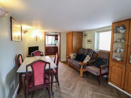 A dining room with a table and chairs at The Farmhouse in Dunmanway, County Cork