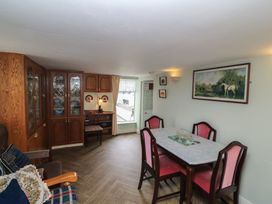 A dining room with a table and chairs at The Farmhouse in Dunmanway, County Cork