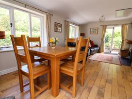 A dining room with a table and chairs at The Lambing Shed Dyserth near Prestatyn