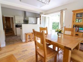 A dining room with a table and chairs at The Lambing Shed in Dyserth near Prestatyn