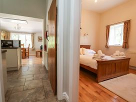A kitchen and bedroom area at The Lambing Shed in Dyserth near Prestatyn