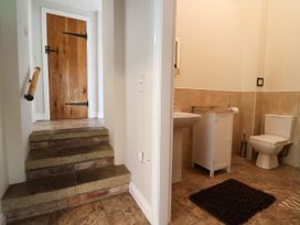 A bathroom with sink and toilet at The Lambing Shed Dyserth near Prestatyn