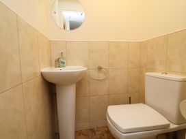 A bathroom with a sink and toilet at The Lambing Shed Dyserth near Prestatyn