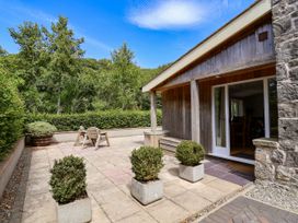 An outdoor area with a table and chairs at The Lambing Shed Dyserth near Prestatyn