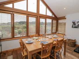 A dining room with a table set for meals at Lough Cluhir Cottage Union Hall County Cork