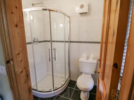 A bathroom with shower and toilet at Lough Cluhir Cottage in Union Hall, County Cork