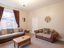 A living room with a coffee table and two sofas at The Lodge Snainton near Scarborough