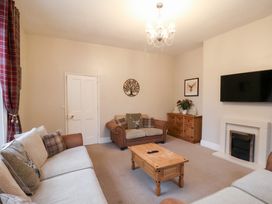 A living room with sofas and a coffee table at The Lodge in Snainton near Scarborough