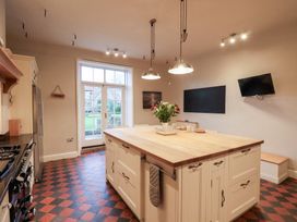 A kitchen with an island and appliances at The Lodge in Snainton near Scarborough