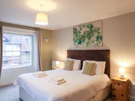 A bedroom with a double bed and bedside tables at The Lodge in Snainton near Scarborough