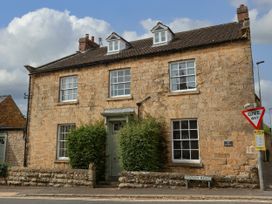 A house with stone exterior and windows at The Lodge Snainton near Scarborough