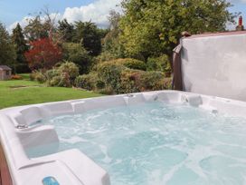 A hot tub with water in a garden at The Lodge Snainton near Scarborough