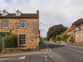 A street scene with a building and traffic sign at The Lodge Snainton near Scarborough