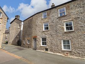 An exterior view of a stone building in Kirkby Lonsdale