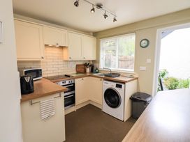 A kitchen with appliances and a countertop at Back Cottage in Kirkby Lonsdale