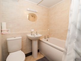 A bathroom with a toilet, sink and bathtub at Wethercote Cottage Old Byland near Helmsley