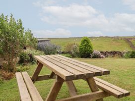 A picnic table in a garden at Wethercote Cottage Old Byland near Helmsley