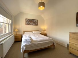 A bedroom with a bed and bedside lamps at Sterling House in Robin Hood's Bay