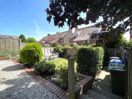 A garden with seating area at Sterling House in Robin Hood's Bay