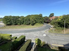 A view of a road and trees at Sterling House in Robin Hood's Bay