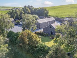 An outdoor view of barns and garden at Woodside Barn Pennington near Ulverston