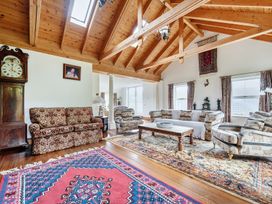 A living room with a sofa and a coffee table at Chapel Green in Polgooth