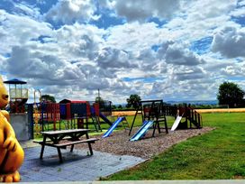 A playground with slides and swings at Boundcliffe Farm Allerston near Pickering