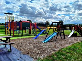 A playground with slides and swings at Boundcliffe Farm in Allerston near Pickering