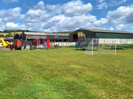 An outdoor playground with a slide and trampoline at Boundcliffe Farm in Allerston near Pickering