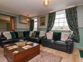 A living room with two sofas and a coffee table at Boundcliffe Farm in Allerston near Pickering