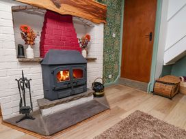 A living room with a wood stove and fireplace at Boundcliffe Farm in Allerston near Pickering