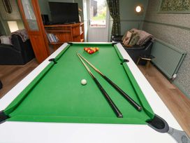 A pool table with cue sticks at Boundcliffe Farm Allerston near Pickering