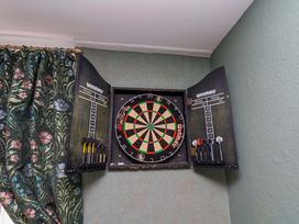 A dartboard and scoreboards mounted on the wall at Boundcliffe Farm in Allerston near Pickering