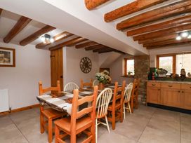 A dining room with a table and chairs at Boundcliffe Farm in Allerston near Pickering