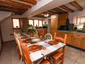 A kitchen with a dining table and chairs at Boundcliffe Farm in Allerston near Pickering