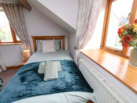 A bedroom with a single bed and a window at Boundcliffe Farm Allerston near Pickering