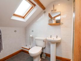 A bathroom with a toilet and sink at Boundcliffe Farm in Allerston near Pickering