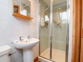 A bathroom with a sink, toilet, and shower at Boundcliffe Farm in Allerston near Pickering