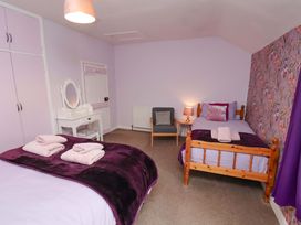 A bedroom with a double bed and a single bed at Boundcliffe Farm in Allerston near Pickering