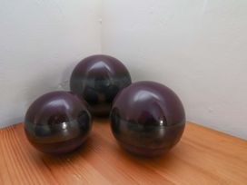 Three decorative spheres on a wooden surface at Boundcliffe Farm, Allerston near Pickering