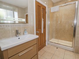 A bathroom with a sink and shower at Tyddyn Goronwy in Talybont