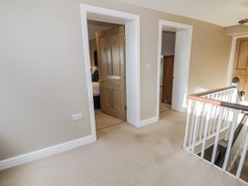 A hallway with doors at Tyddyn Goronwy Talybont