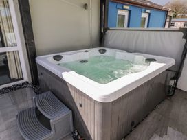 A hot tub with steps at Meadow View in Laugharne