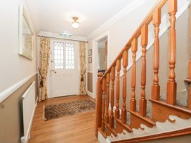 A hallway with a staircase and a front door at The Croft in Vowchurch near Peterchurch