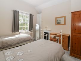 A bedroom with two beds and a window at The Croft in Vowchurch near Peterchurch