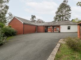 A building with a driveway and trees at The Croft in Vowchurch near Peterchurch