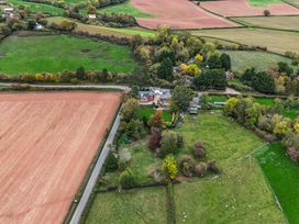 A landscape view of fields and houses at The Croft in Vowchurch near Peterchurch