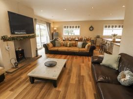 A living room with a sofa and coffee table at White Gables in Great Clifton near Cockermouth