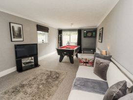 A snug with a pool table and a dartboard at White Gables in Great Clifton near Cockermouth