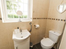 A bathroom with a sink and toilet at White Gables Great Clifton near Cockermouth